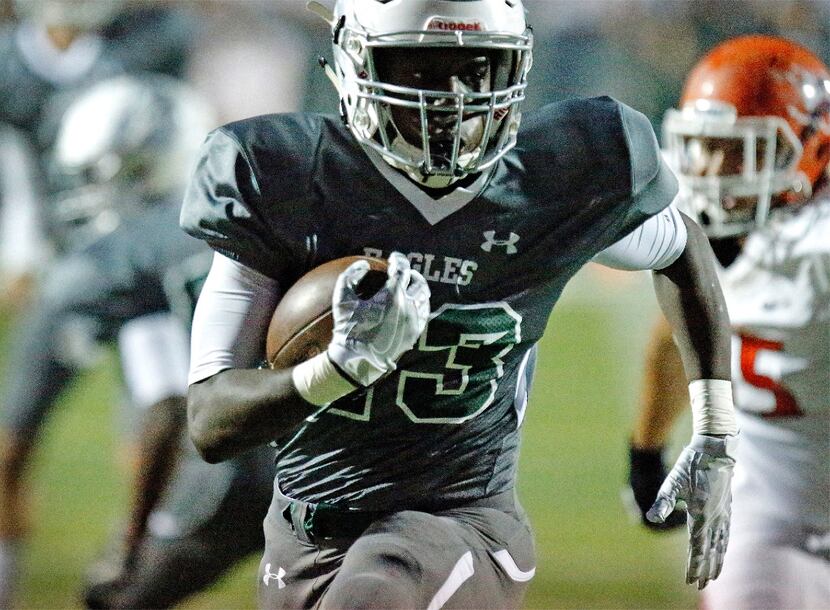 Prosper High School running back Wayne Anderson (23) gets the first score in the game on a...