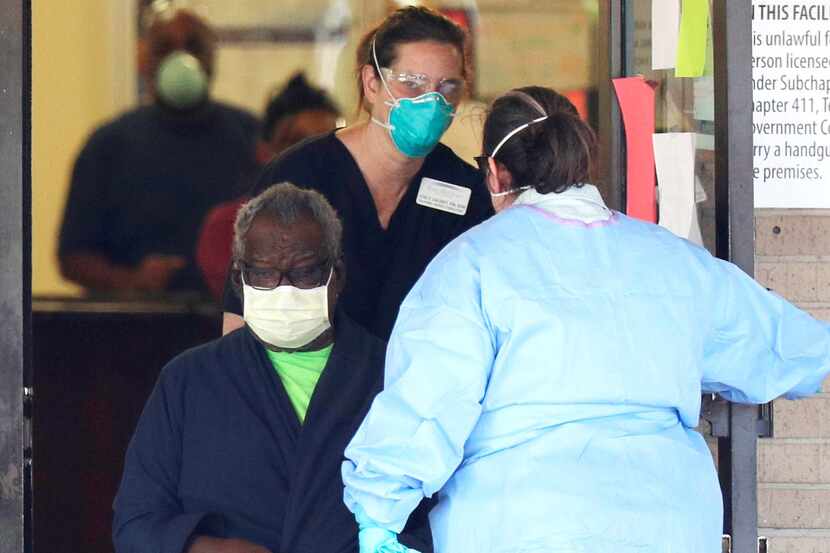 A resident is removed from the Southeast Nursing and Rehabilitation Center in San Antonio...