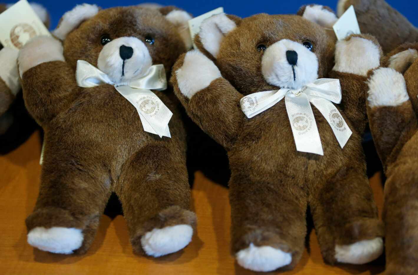 Teddy bears sit on the table during a press conference at Grand Prairie Police Department in...