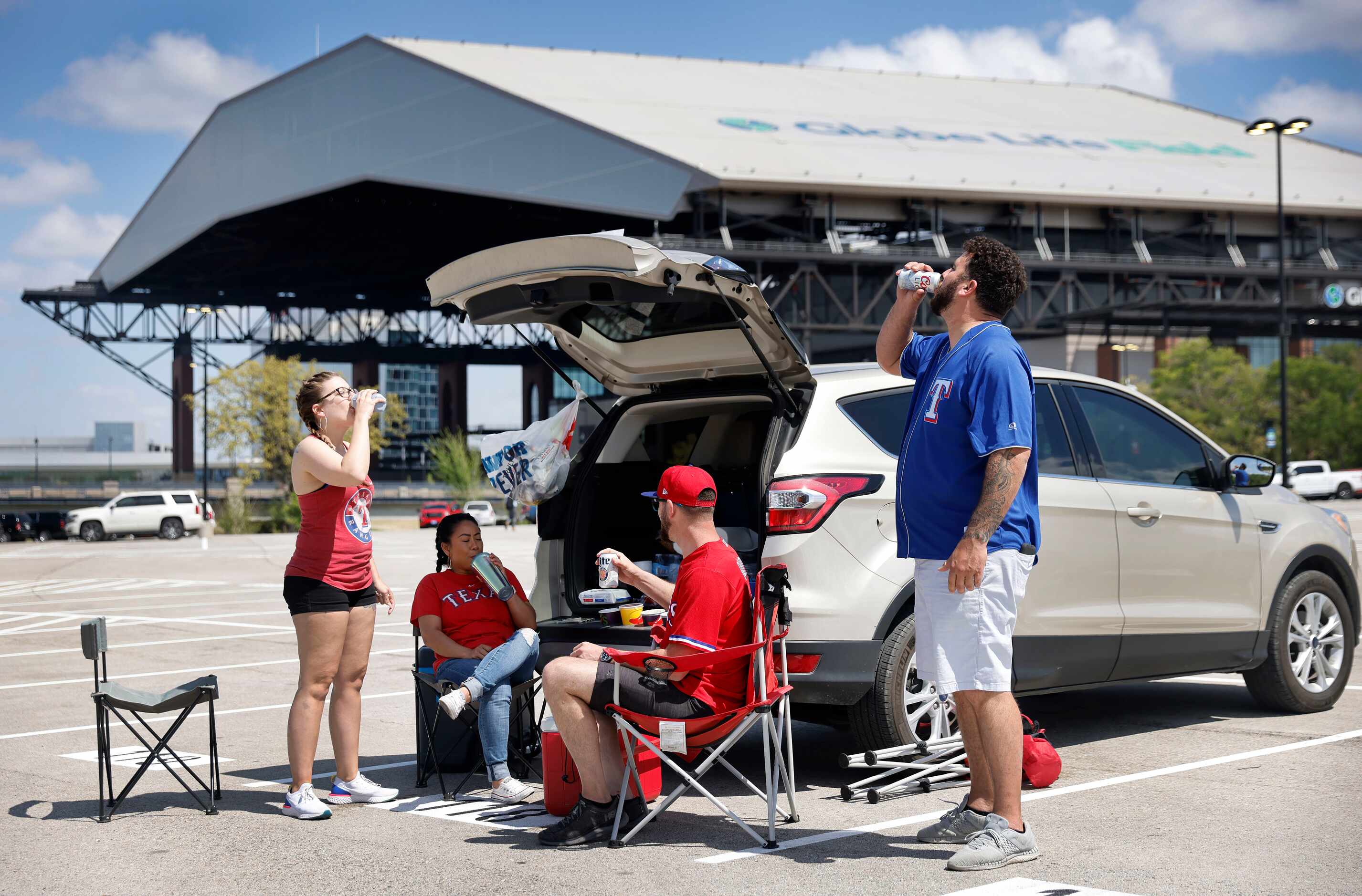 Texas Rangers fans (from left) Tiffany Phillips, Scout Chitavong, Jaime Shannon, and Cameron...