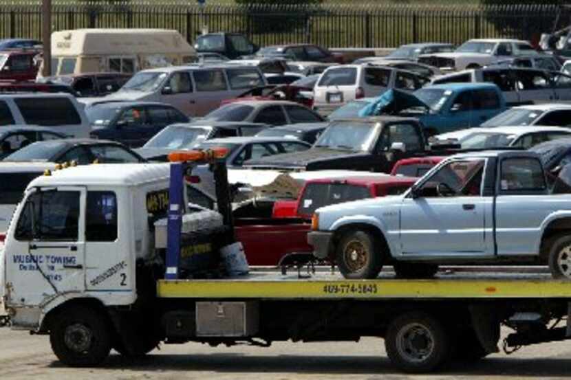 A vehicle is delivered to the Dallas Police Department's impound lot.