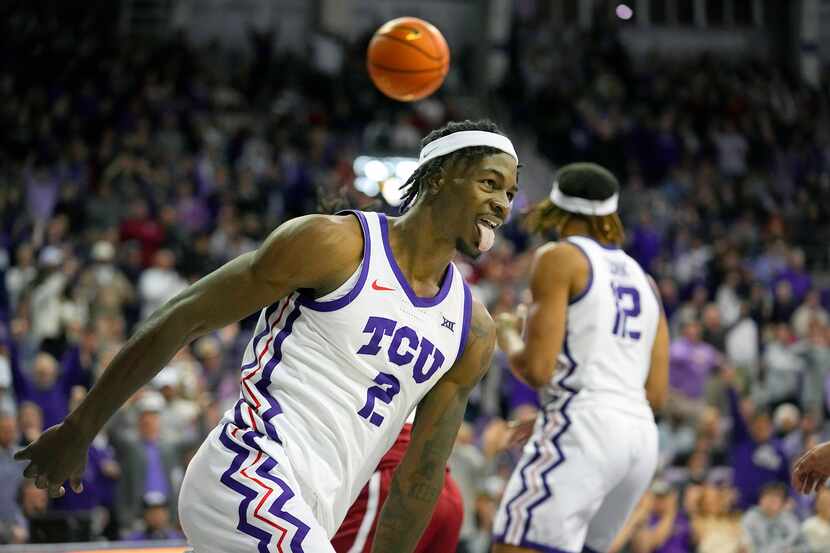 TCU forward Emanuel Miller (2) reacts to scoring a basket during the second half of an NCAA...