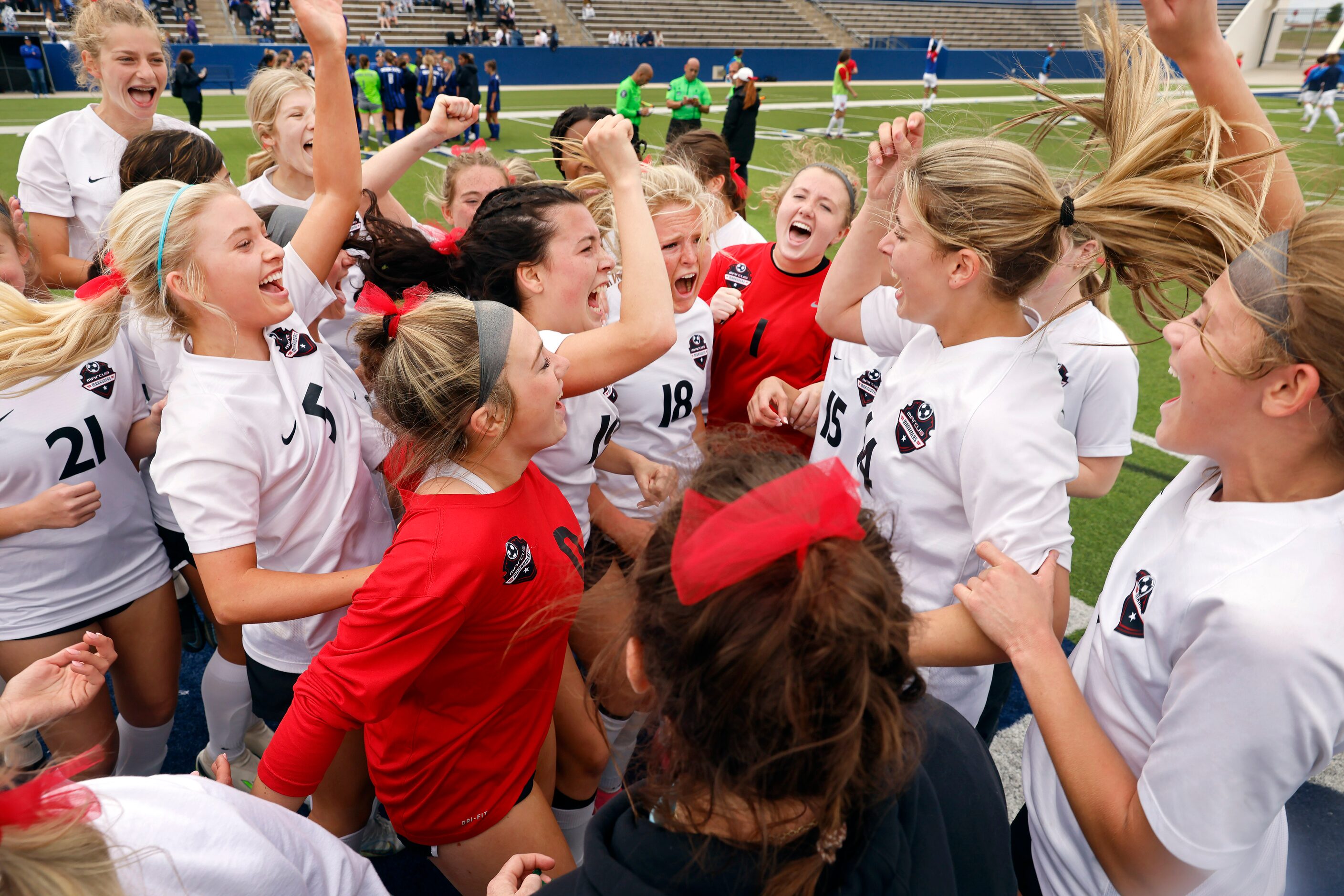 The Flower Mound Marcus girls soccer team celebrates their double overtime win over Trophy...