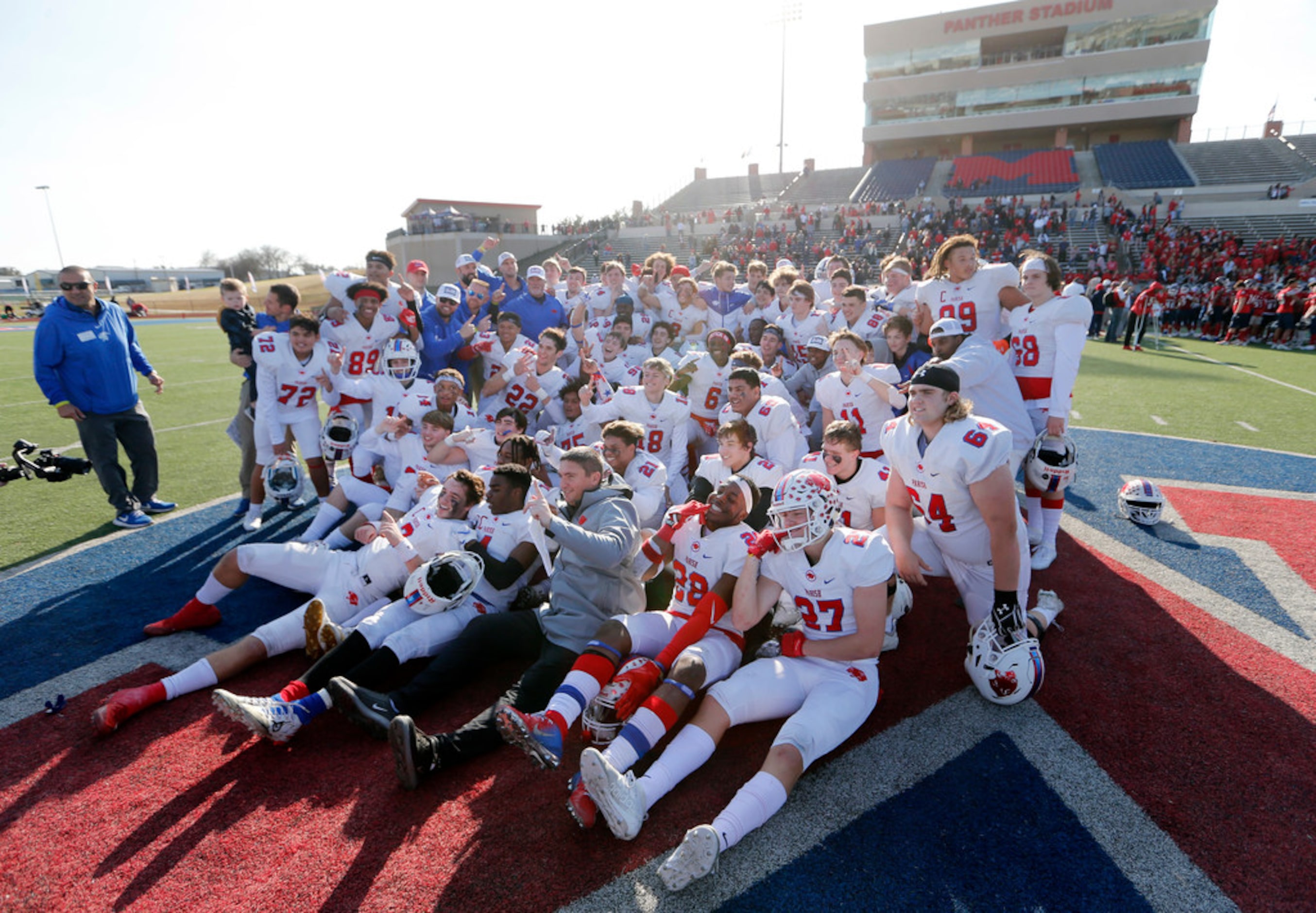 Parish Episcopal football team poses for a portrait on the field after defeating Plano John...