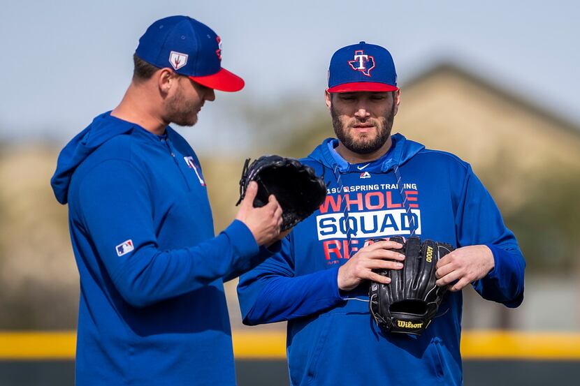 Texas Rangers pitcher Lance Lynn (right) talks with pitcher Connor Sadzeck during a spring...