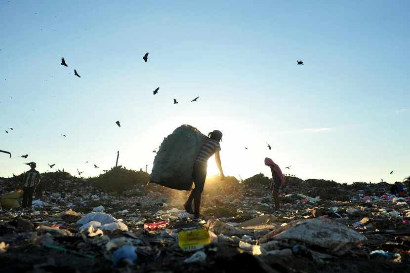 
Young children collect waste at a landfill in Managua. Child labour is a growing problem in...
