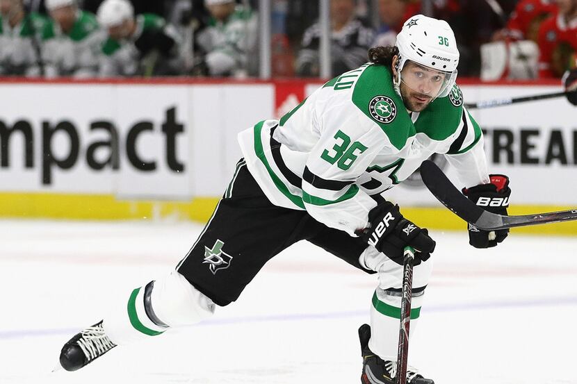 CHICAGO, ILLINOIS - FEBRUARY 24: Mats Zuccarello #36 of the Dallas Stars skates up the ice...