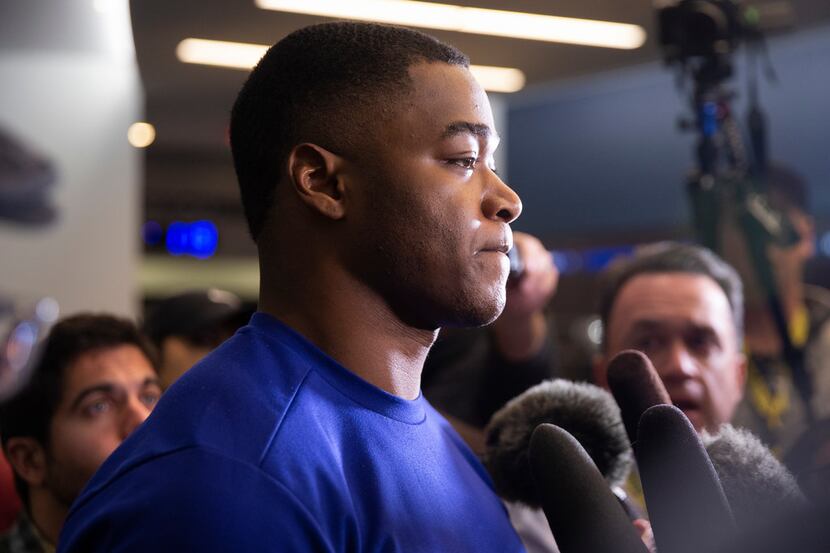 FILE - Cowboys wide receiver Amari Cooper talks to reporters after a team meeting at The...