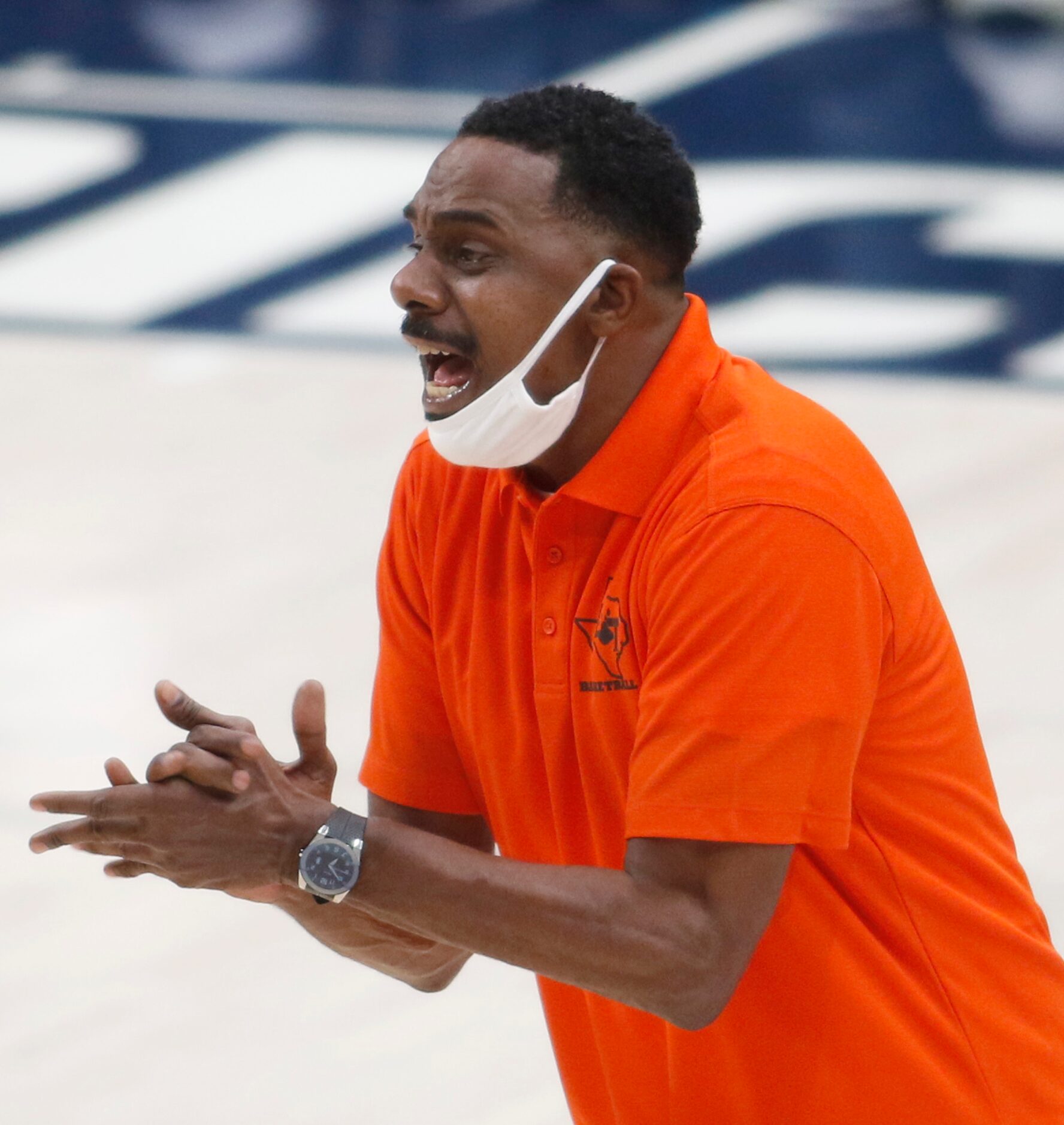 Lancaster head coach Ferrin Douglas encourages his players during the second half of their...