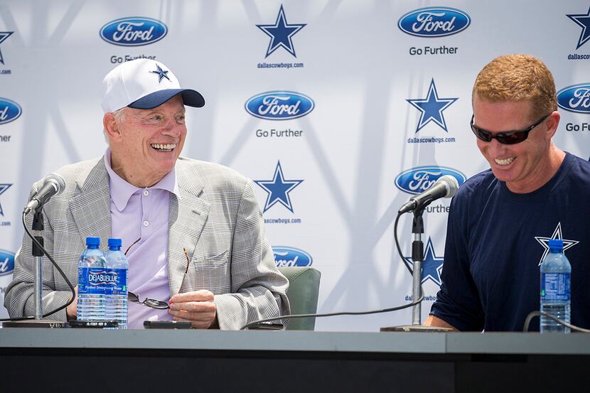 Dallas Cowboys owner Jerry Jones (left) laughs with head coach Jason Garrett during the...