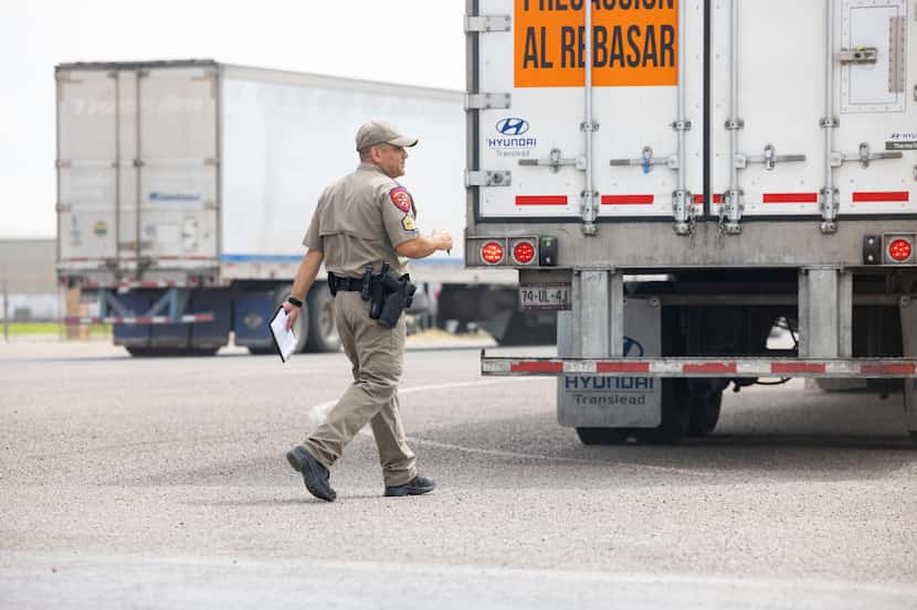 A Texas State Trooper resumes inspecting trucks, following the end of a blockade by drivers...