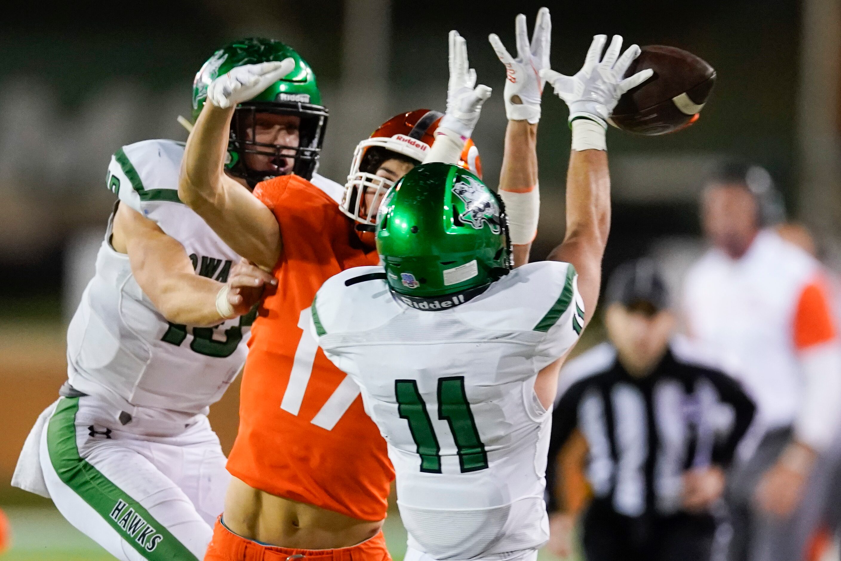 Iowa Park defensive back Tom Garrett Slack (11) breaks up a pass intended for Celina wide...