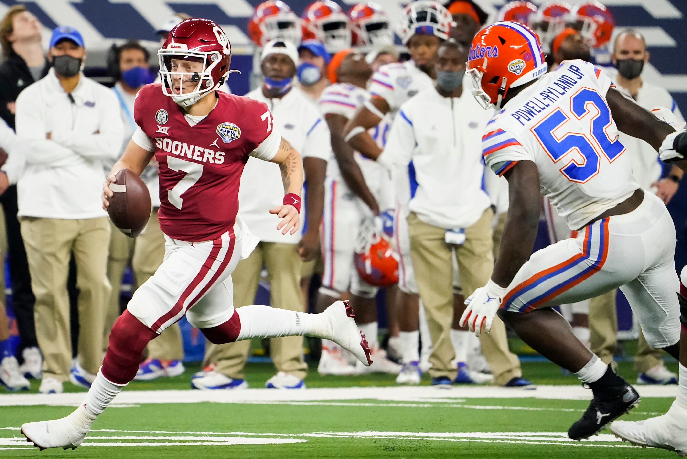 Oklahoma quarterback Spencer Rattler (7) scrambles for a first down past Florida linebacker...