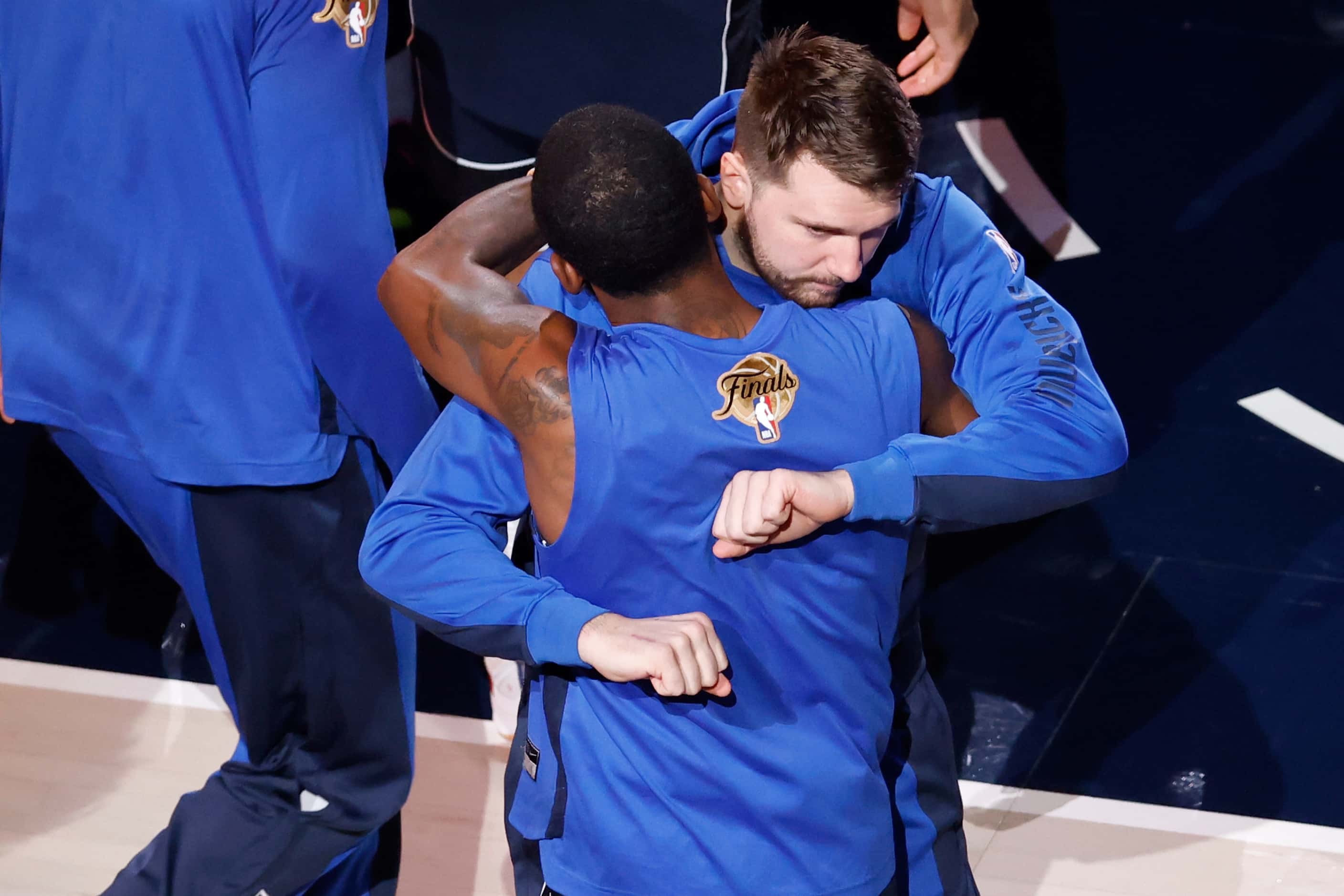 Dallas Mavericks guard Luka Doncic hugs guard Kyrie Irving before Game 4 of the NBA Finals...