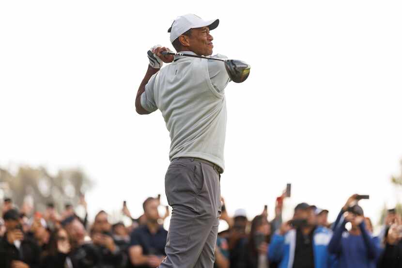 Tiger Woods tees off on the ninth hole during the third round of the Genesis Invitational...