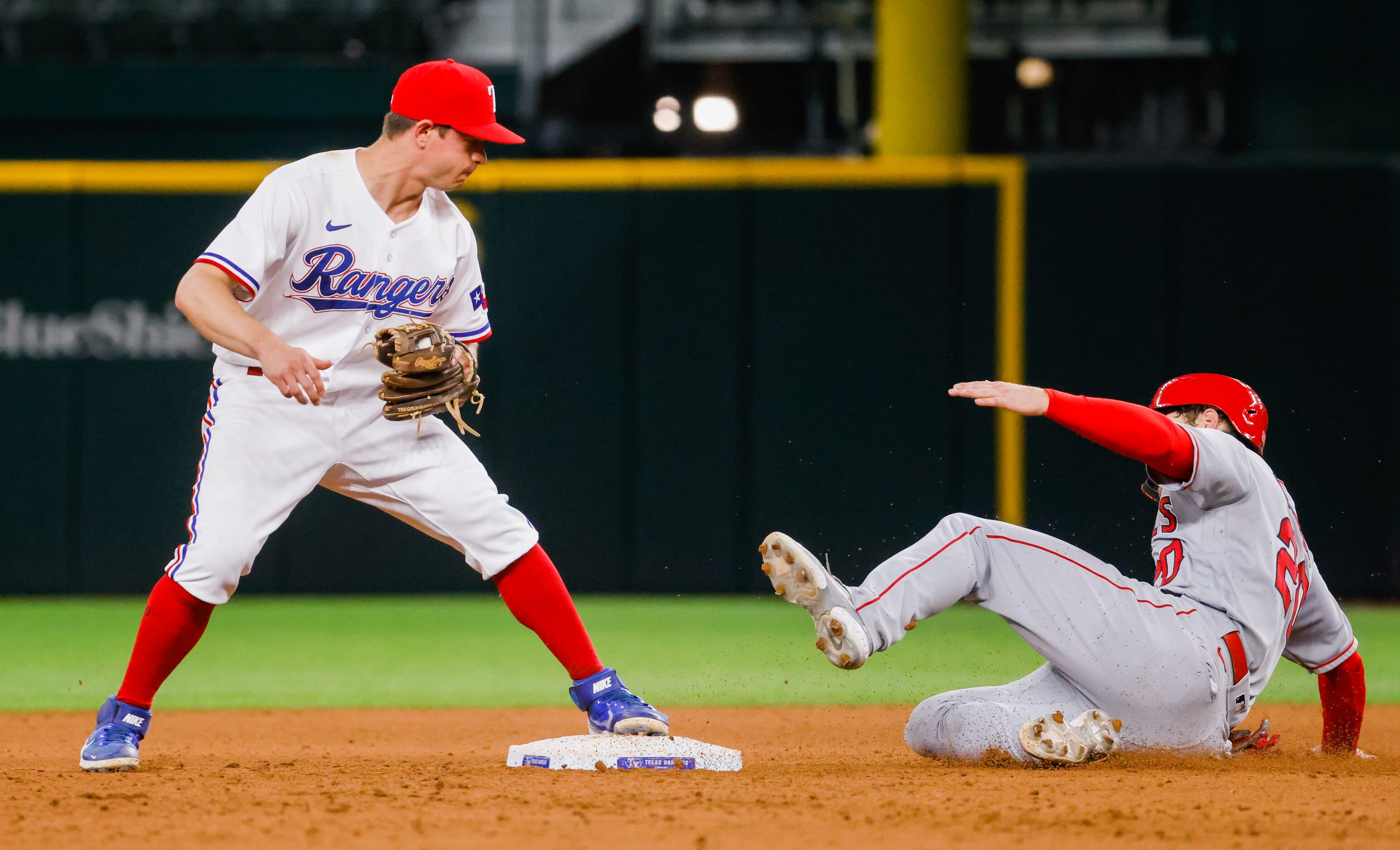 Los Angeles Angels first baseman Jared Walsh (20) is out by Texas Rangers second baseman...