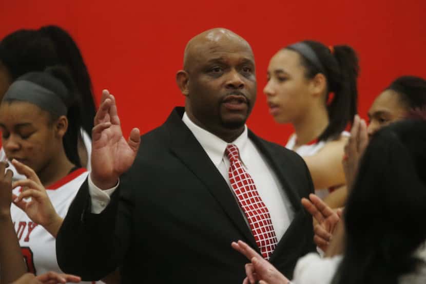 Then-Mesquite Horn girls basketball coach Darrin Samuels talks to his team during a game in...
