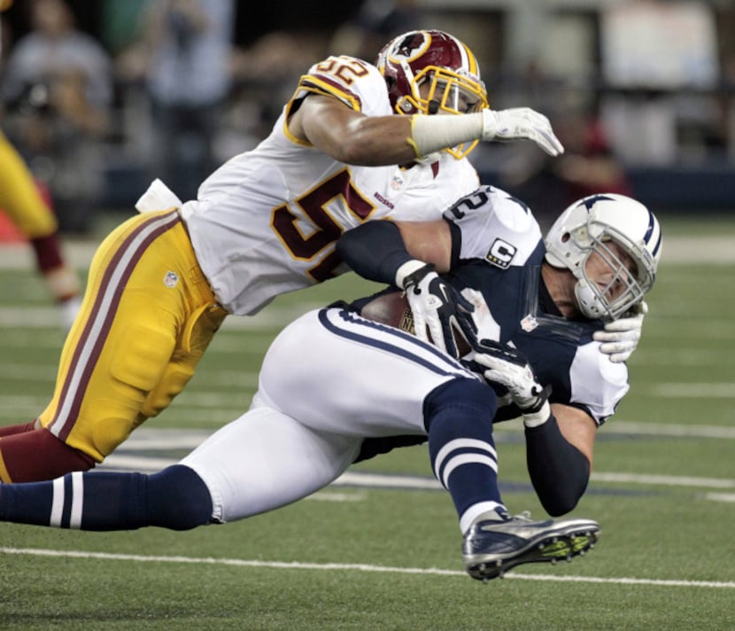 Washington Redskins linebacker Keenan Robinson (52) stops Dallas Cowboys tight end Jason...