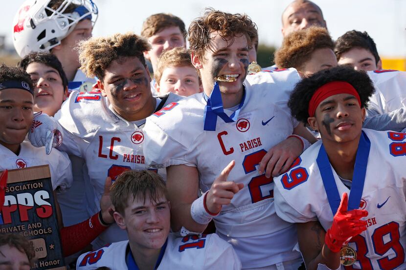 Parish Episcopal's Preston Stone (2) and teammates celebrate their victory over Plano John...