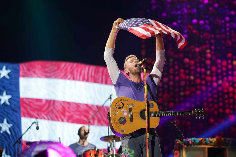 Singer Chris Martin, of Coldplay, performs at the FedEx Field on Sunday, Aug. 6, 2017, in...