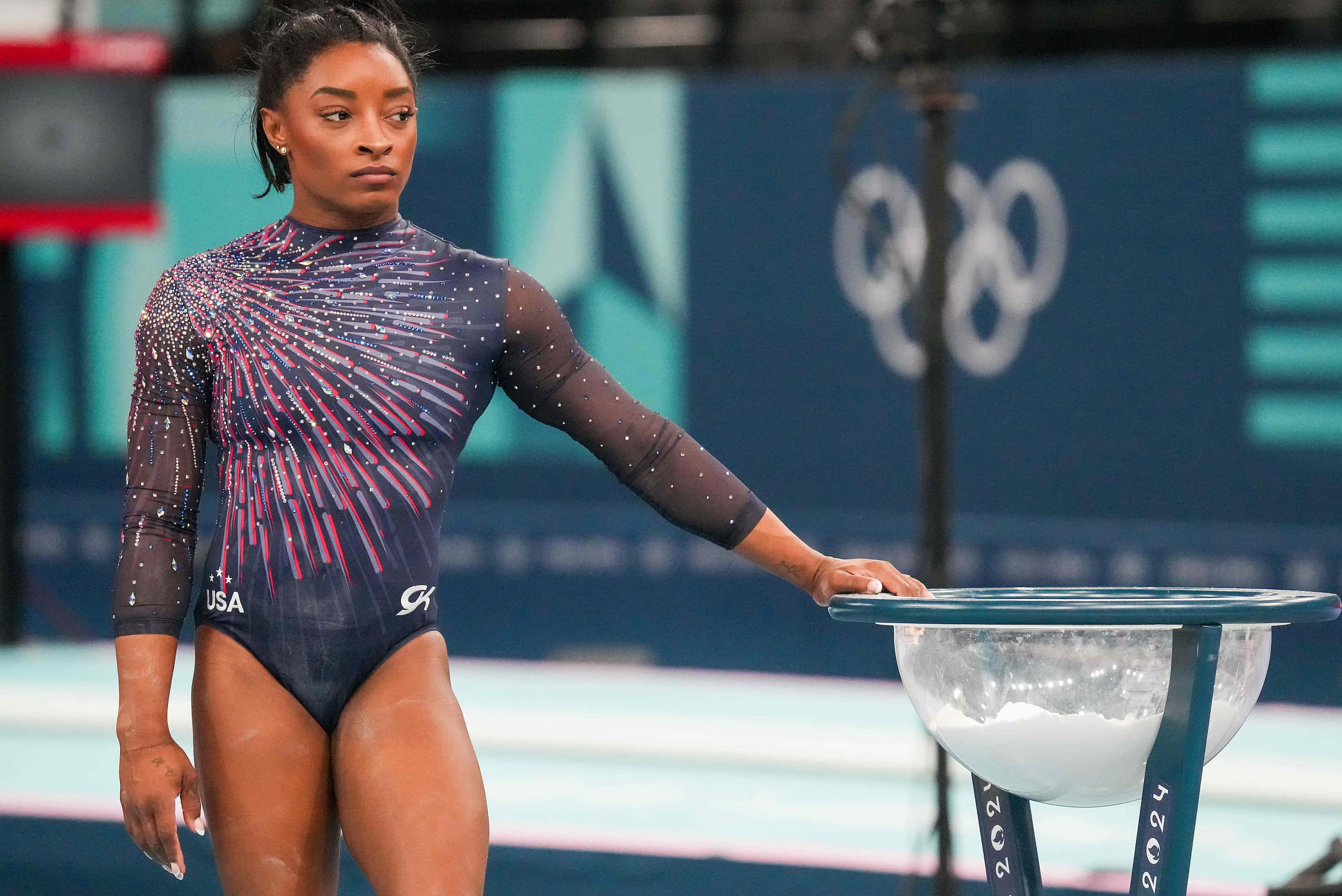 Simone Biles of the United States waits to practice on the balance beam during women’s...