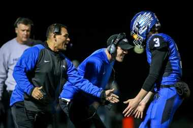 FILE — North Forney quarterback Jacob Acuna (3) celebrates with his coaches after scoring a...