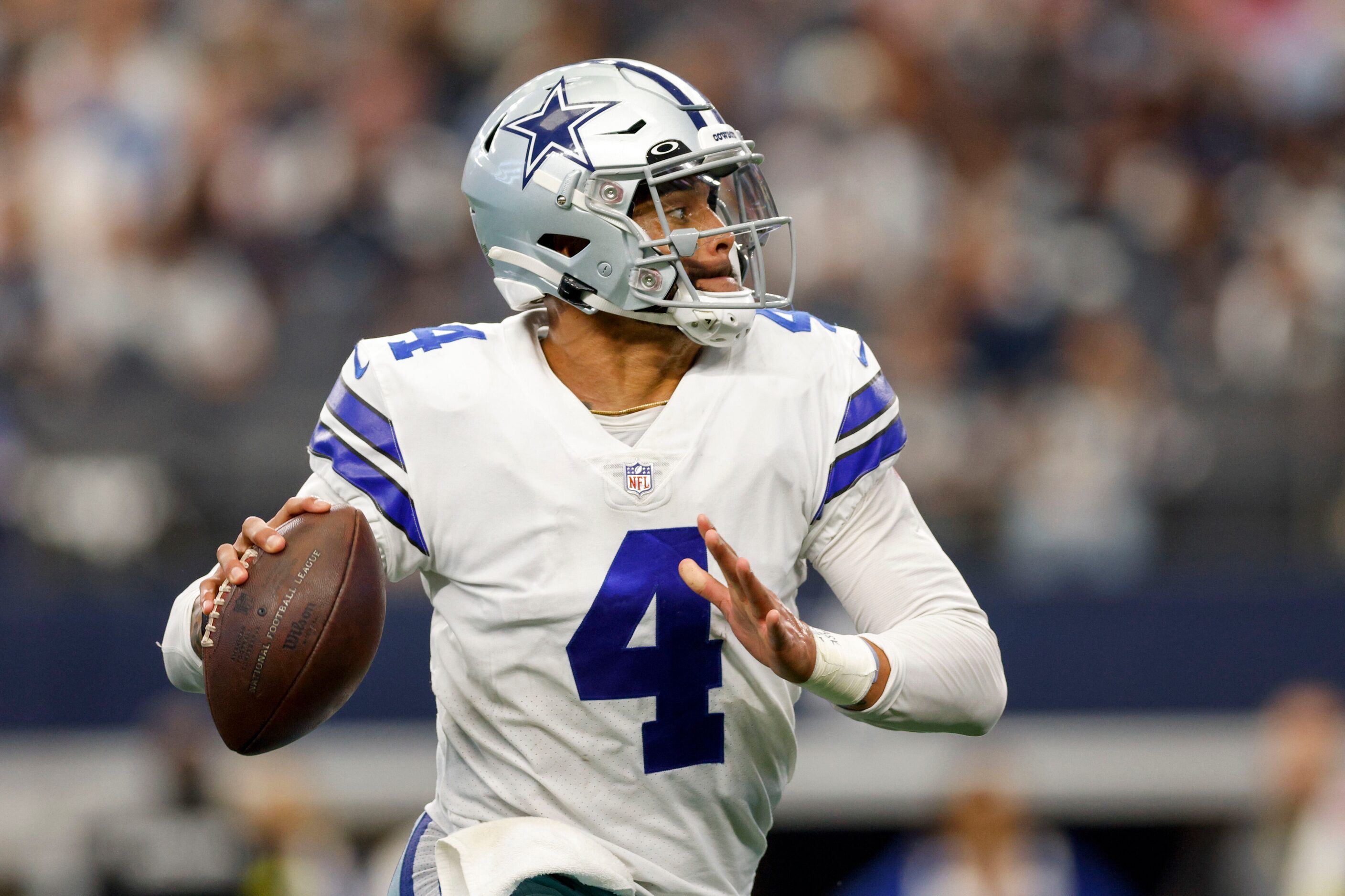 Dallas Cowboys quarterback Dak Prescott (4) looks to pass during the fourth quarter of a NFL...