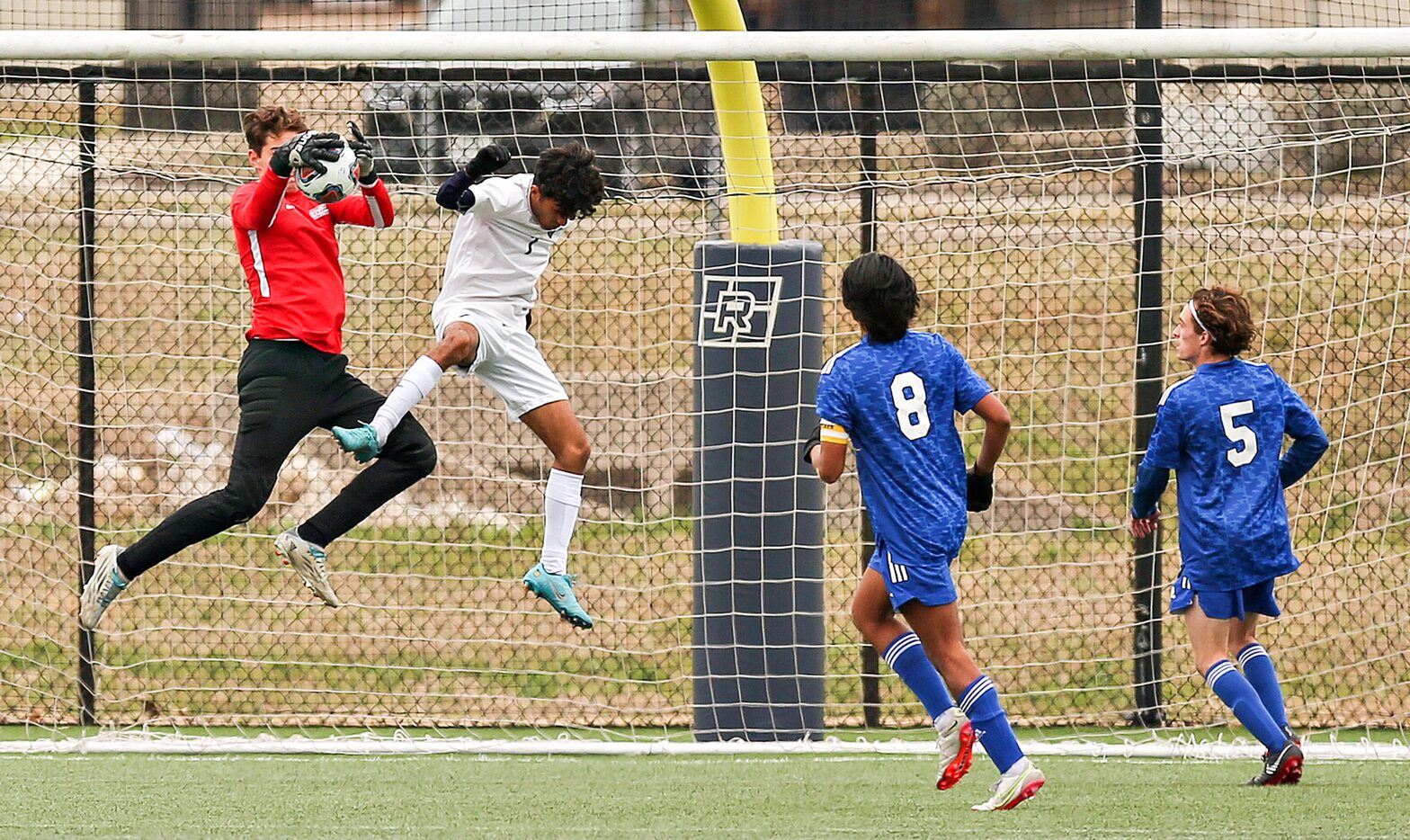 Fort Worth Nolan Catholic’s Christopher Lewis (40) with the support of Matthew Martinez (8)...