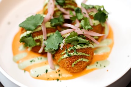 Elote arancini at Thomas Avenue Beverage Company are fried balls of risotto, corn and Hatch...