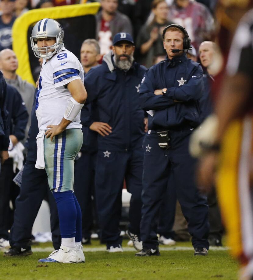 Dallas Cowboys quarterback Tony Romo (9) and Dallas Cowboys head coach Jason Garrett look...
