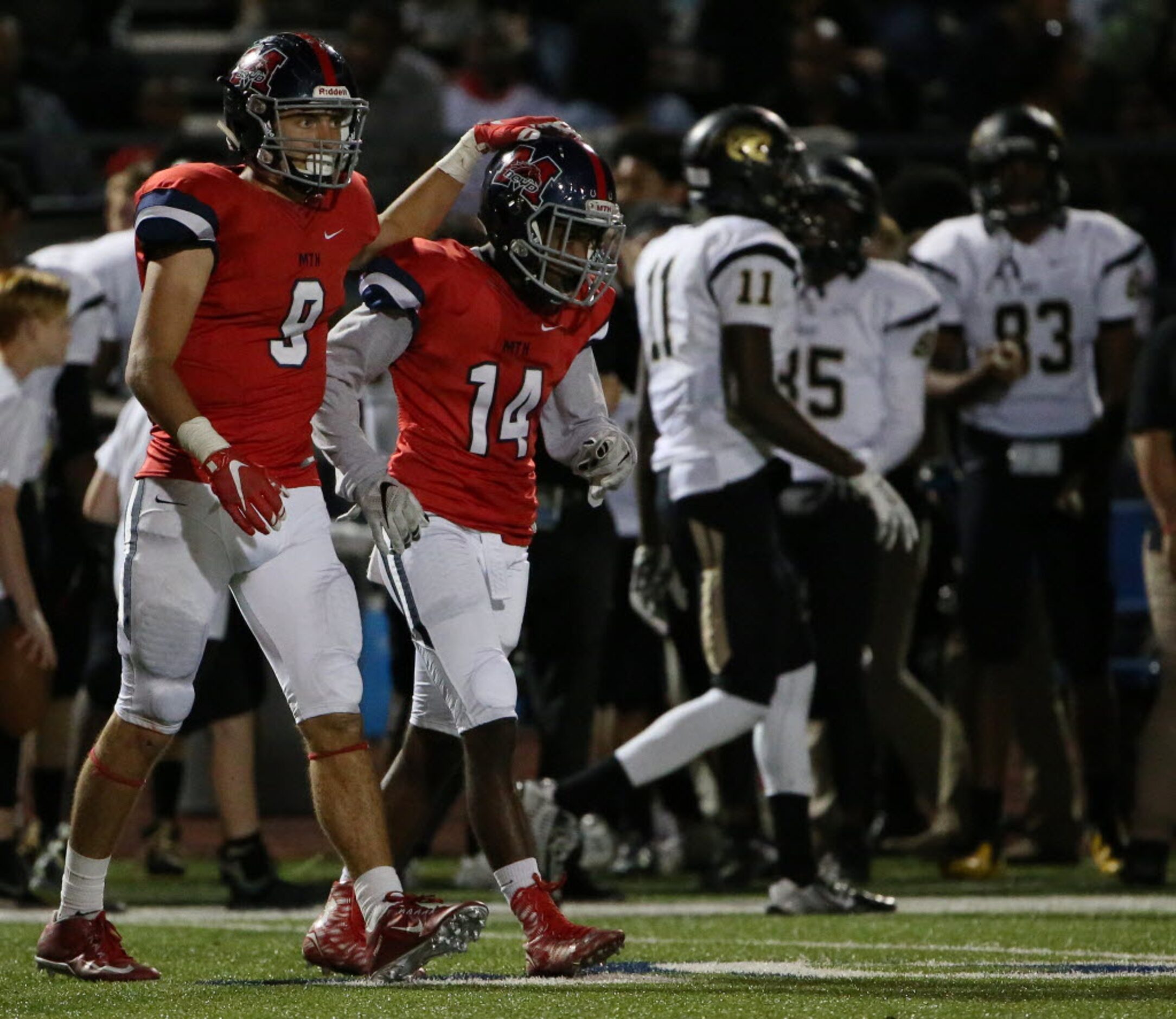 McKinney Boyd defensive back Armani Jenkins (14) is congratulated by defensive back Parker...