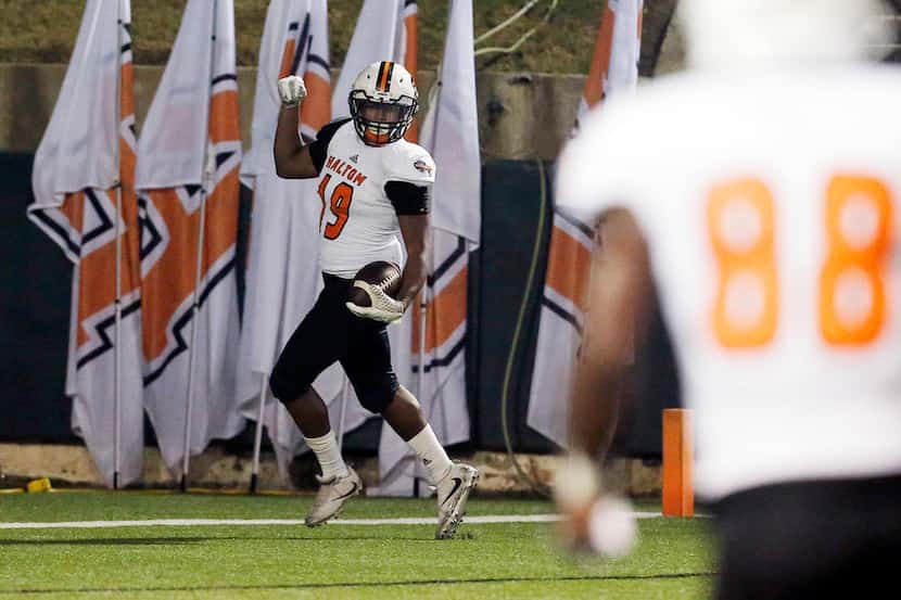 TXHSFB Haltom sophomore wide receiver Kenneth Cormier (19) celebrates a touchdown during the...