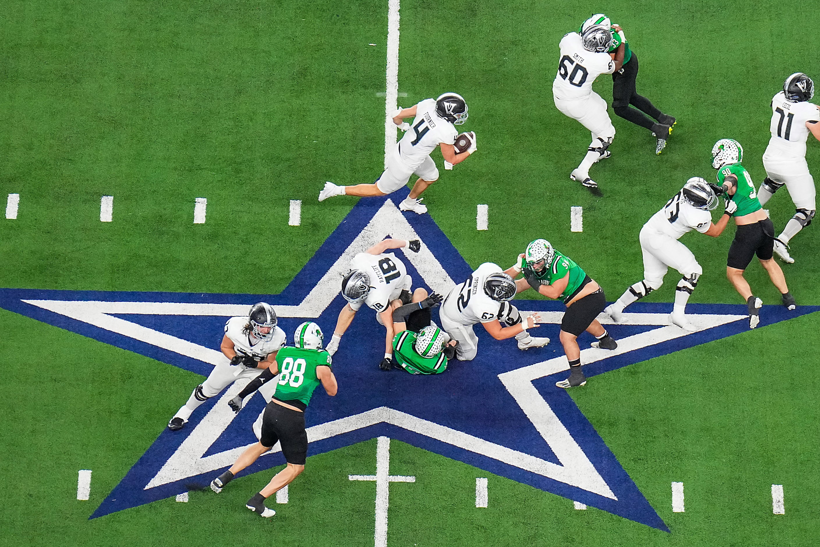 Austin Vandegrift running back Brendan Fournier (4) picks up a first down as he crosses...