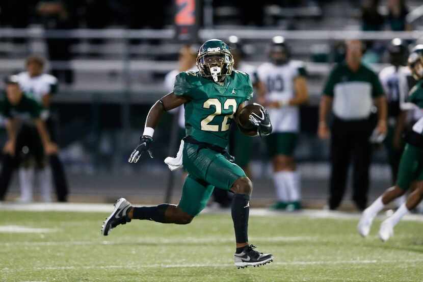 DeSoto's Jyison Brown (22) breaks for a long rushing touchdown in a game against Mansfield...