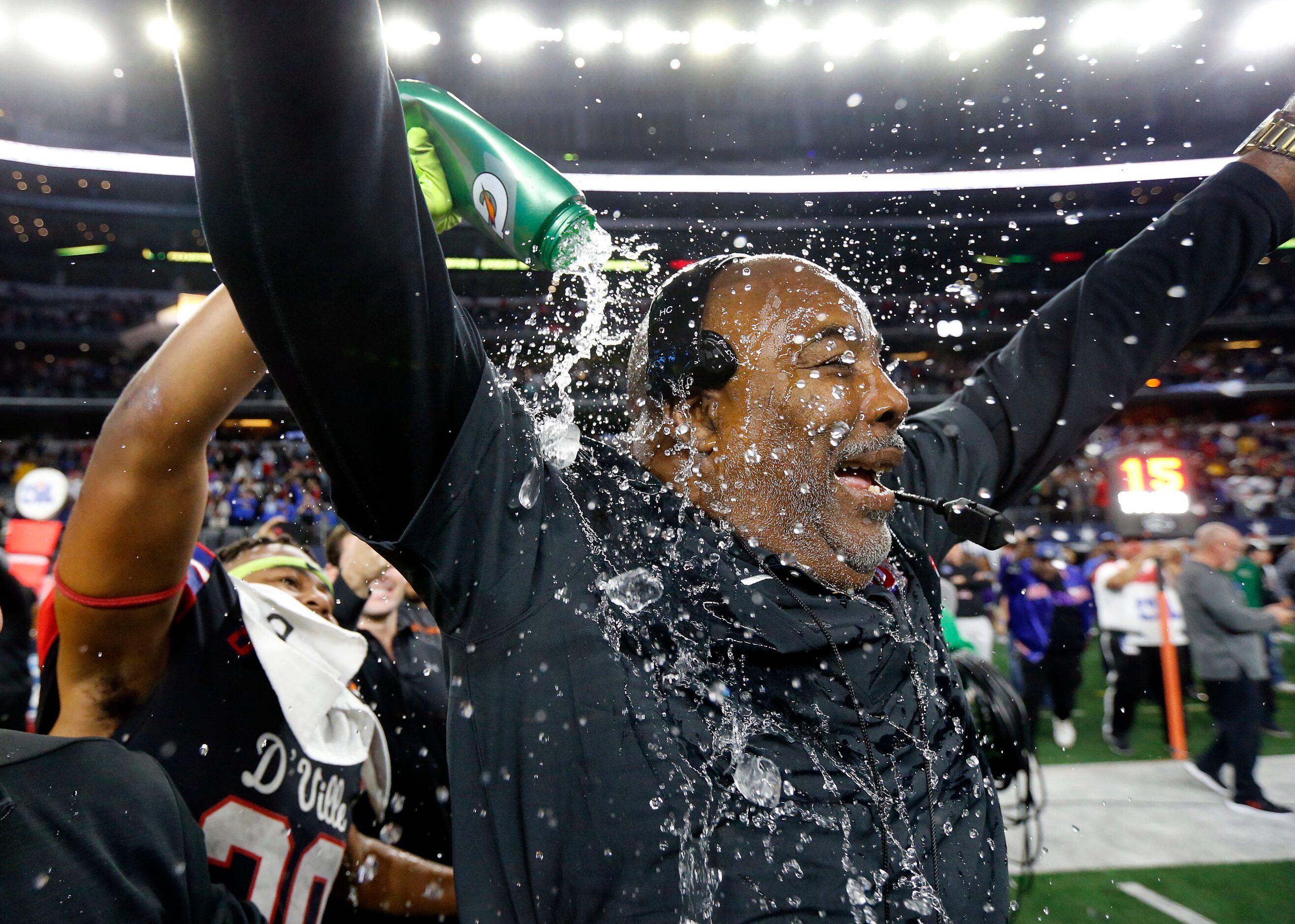 Duncanville head coach Reginald Samples celebrates their Class 6A Division I state...