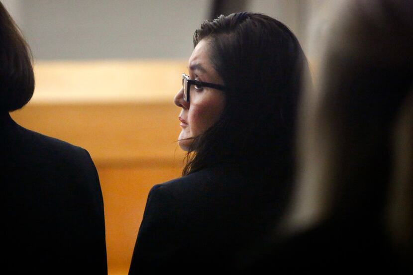 Defendant Brenda Delgado looks over her shoulder during her murder trial in the 363rd...