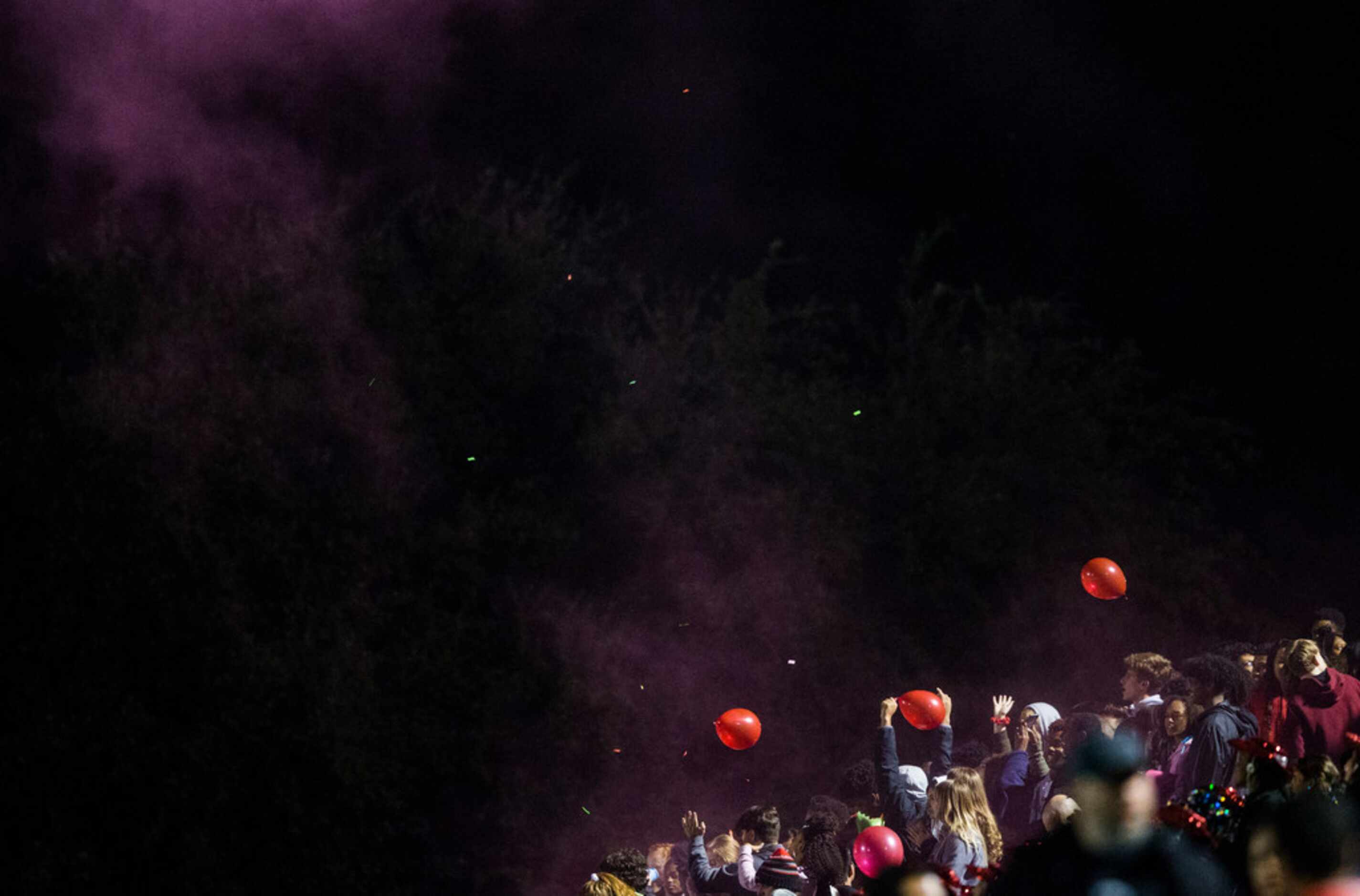 Euless Trinity fans cheer after a touchdown during the first quarter of a UIL Class 6A...