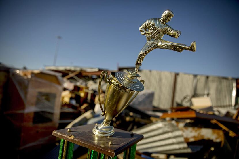 An off-kilter  martial arts trophy and so many other mementos were battered in the Dec. 26...