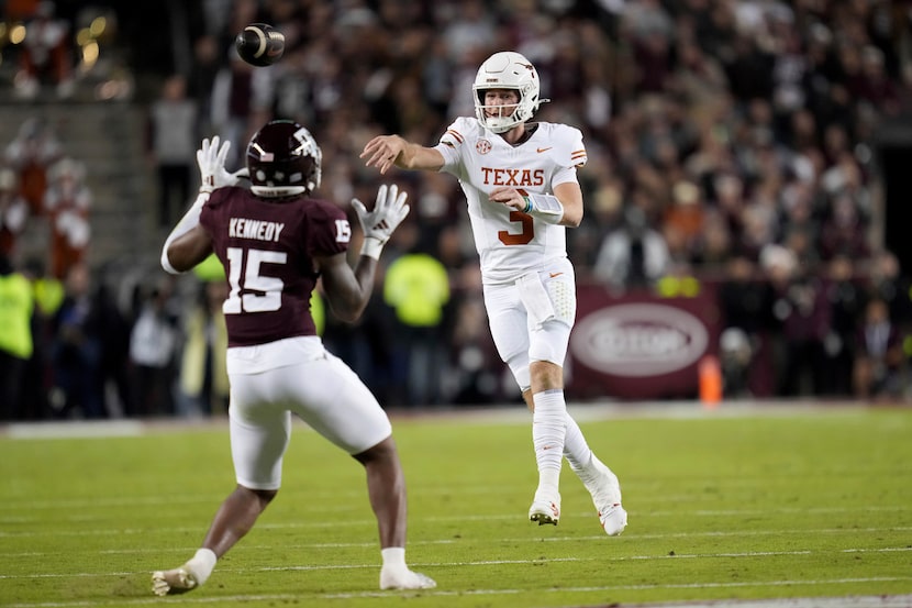 Texas quarterback Quinn Ewers (3) passes down field against Texas A&M defensive lineman...