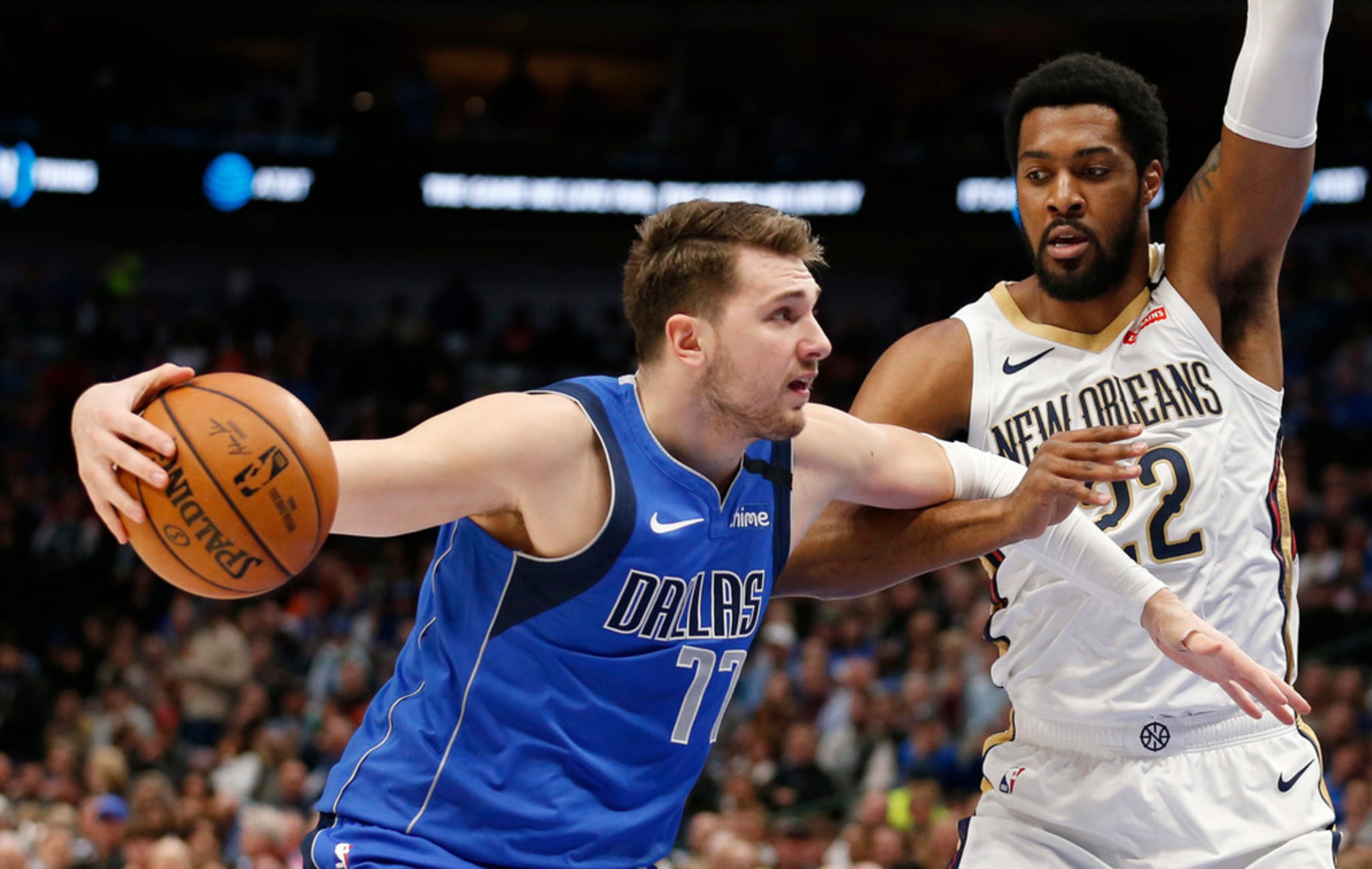 Dallas Mavericks guard Luka Doncic (77) posts up New Orleans Pelicans center Derrick Favors...