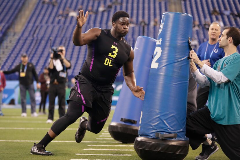 Connecticut defensive lineman Foley Fatukasi runs a drill at the NFL football scouting...