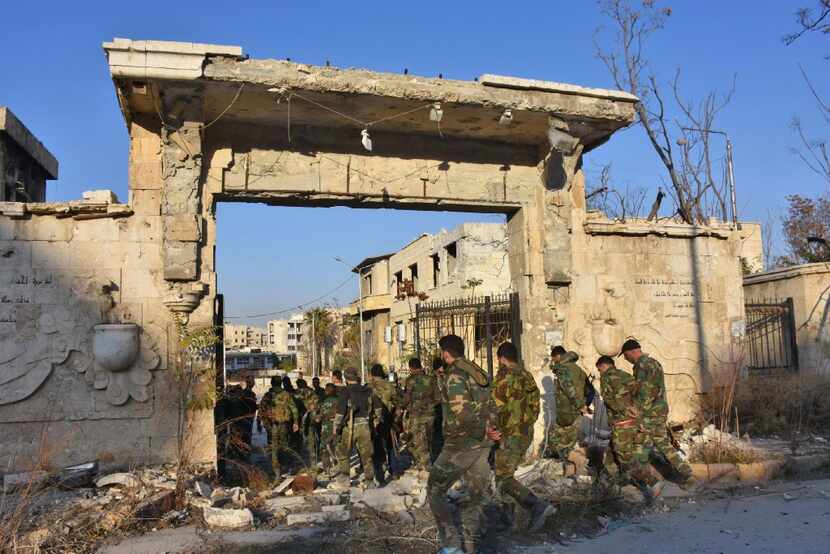 Syrian pro-government forces enter into a water pumping station in Aleppo's Suleiman...