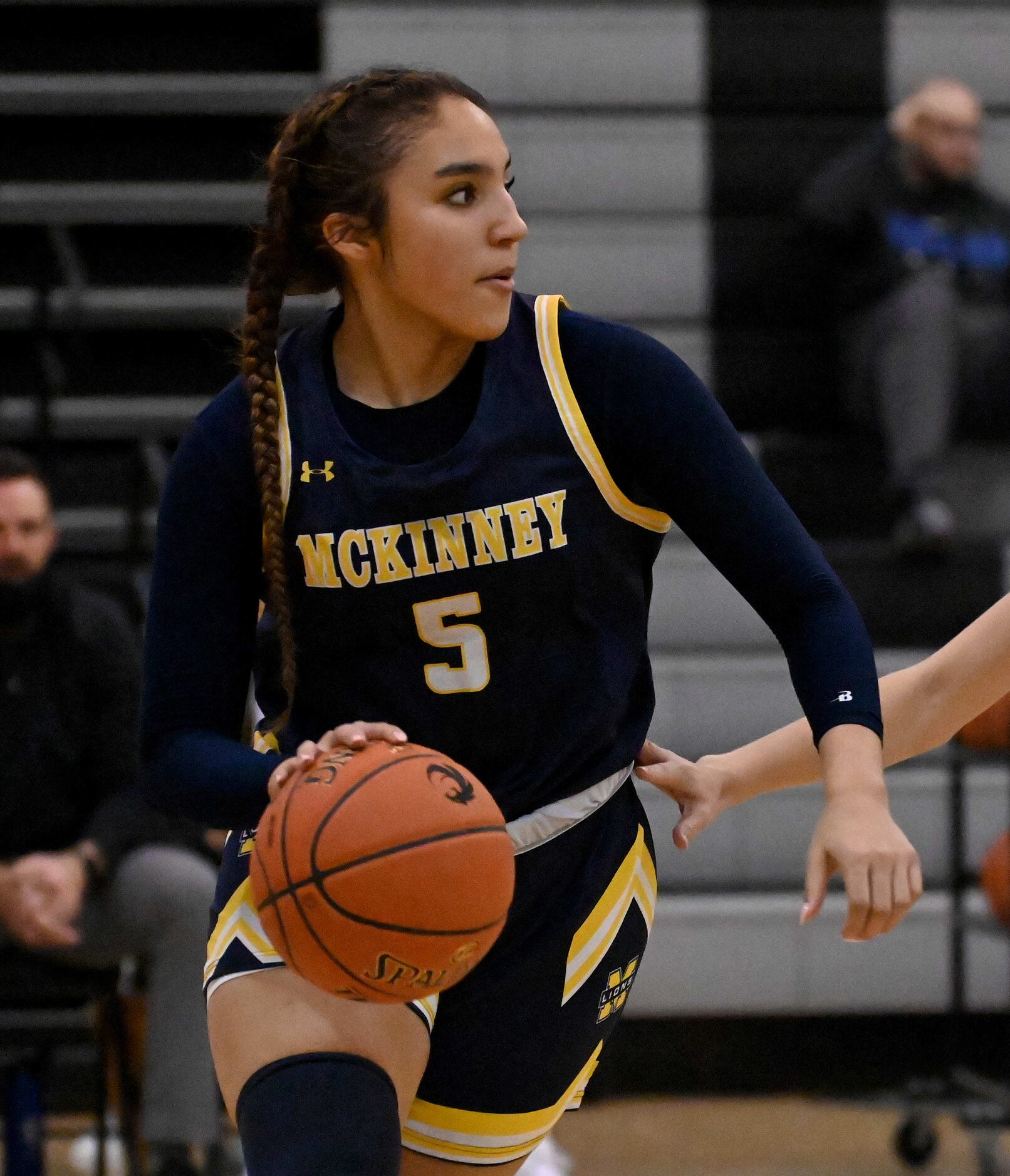 McKinney’s Trinity White (5) brings the ball up court in the second half of a girls high...