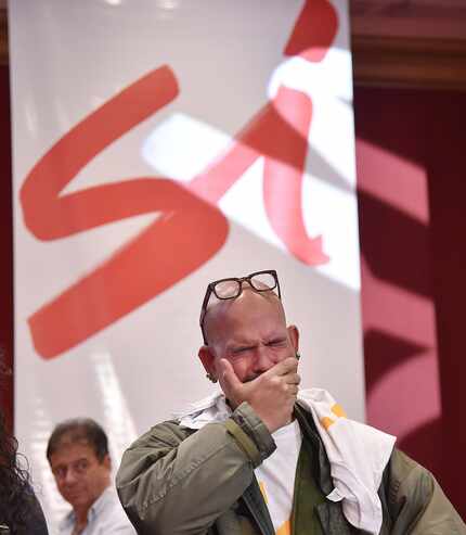 A supporter cries after hearing the results of a referendum on whether to ratify a historic...