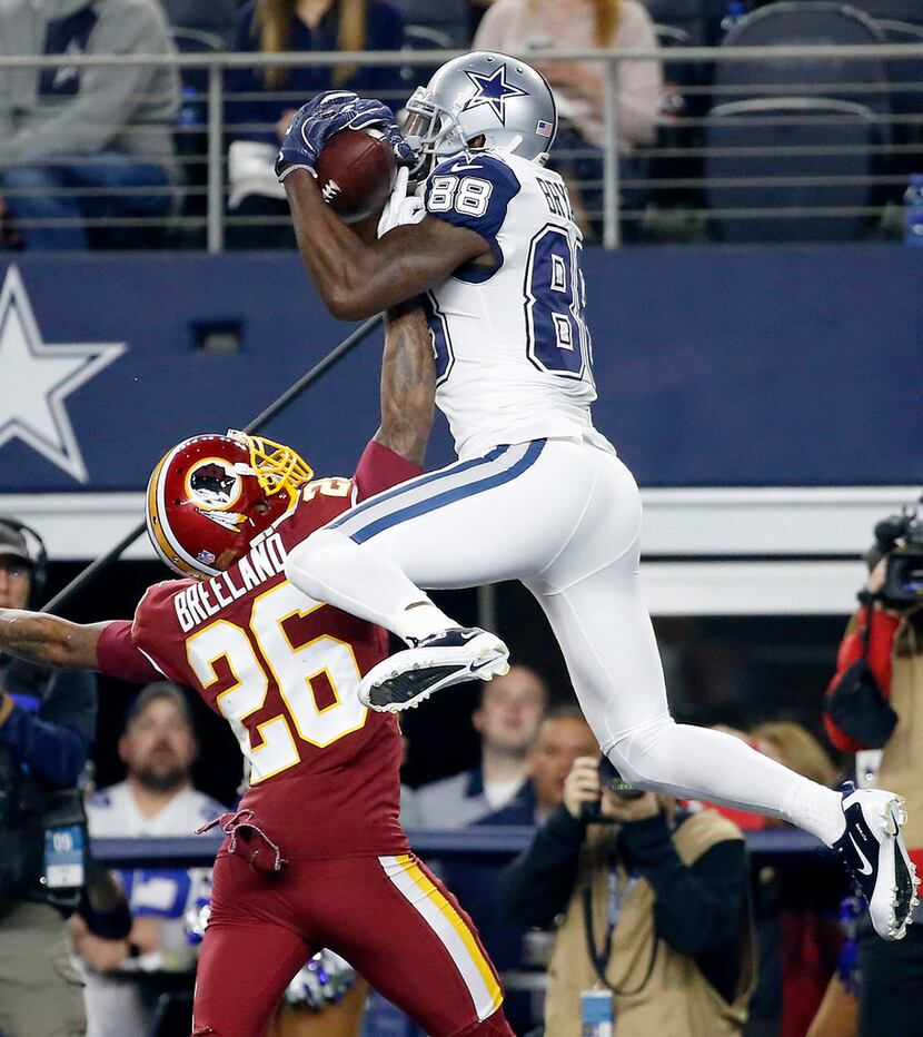 Dallas Cowboys wide receiver Dez Bryant (88) pulls in a touchdown pass over Washington...