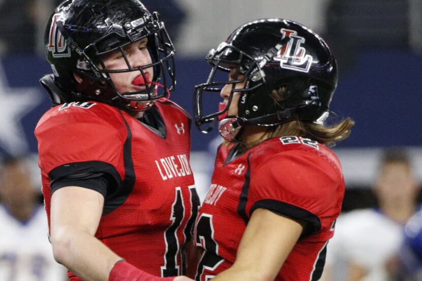 Lovejoy's Bumper Pool (10) and Kevin Davis (22) celebrate after a tackle against Frisco in...
