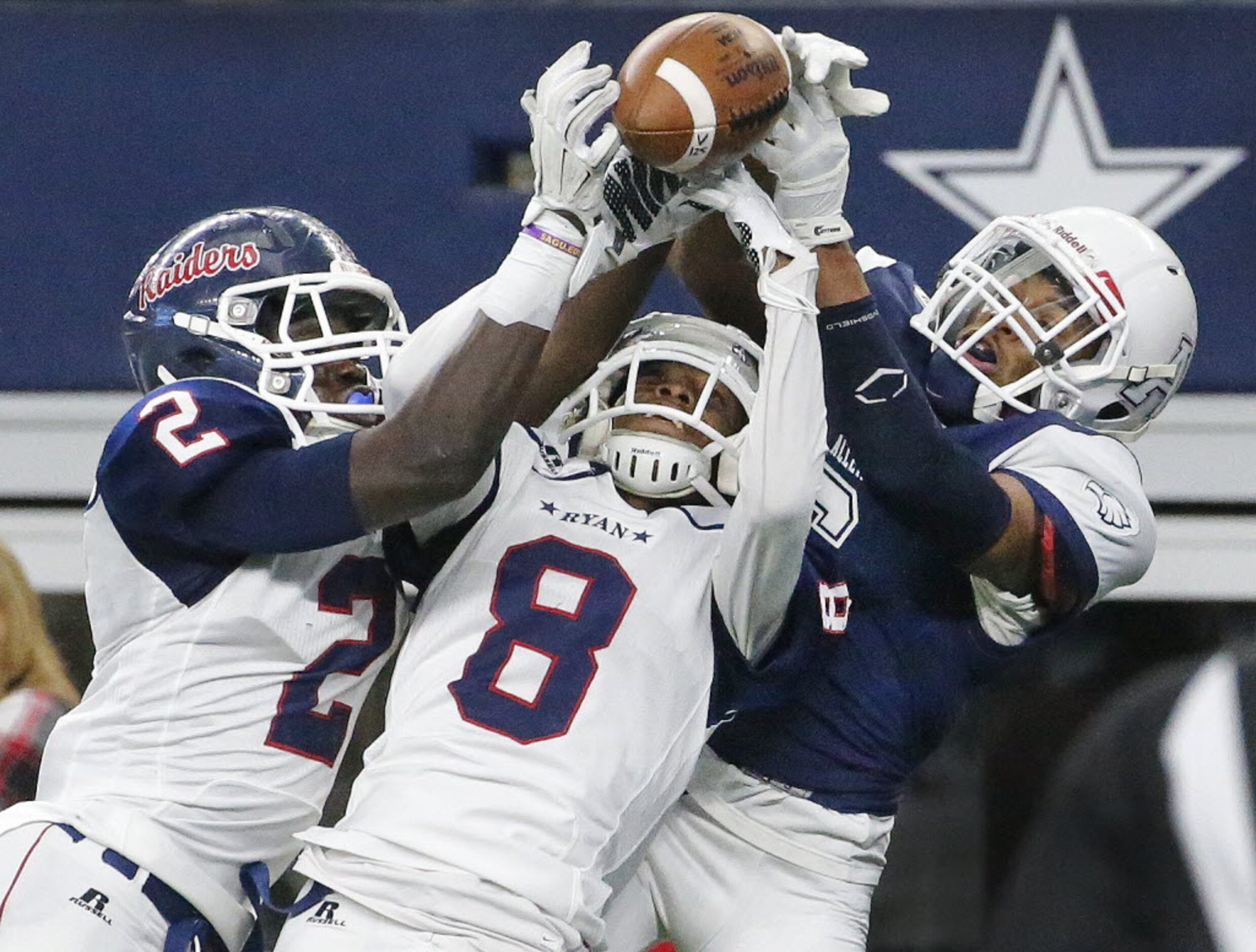 Allen defensive back Anthony Taylor, right, breaks up a pass in the red zone as two Ryan...