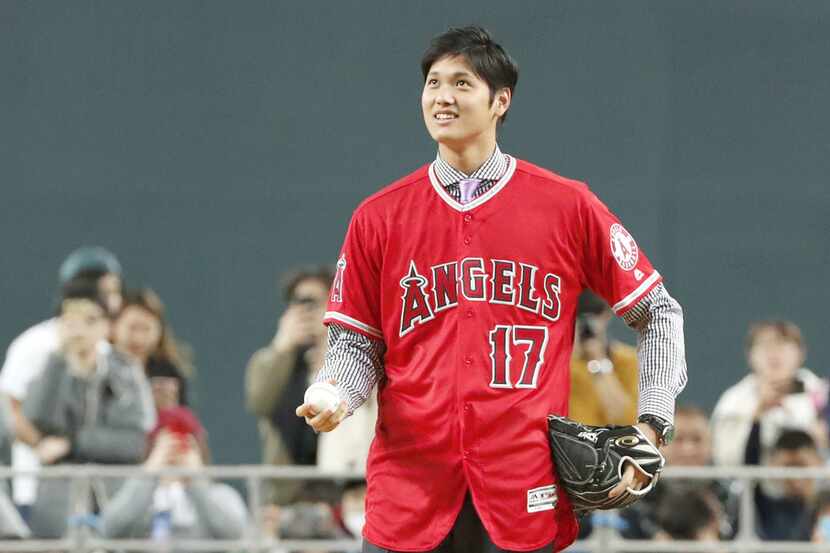 Shohei Ohtani wears an Angels jersey during a news conference in Sapporo, northern Japan...