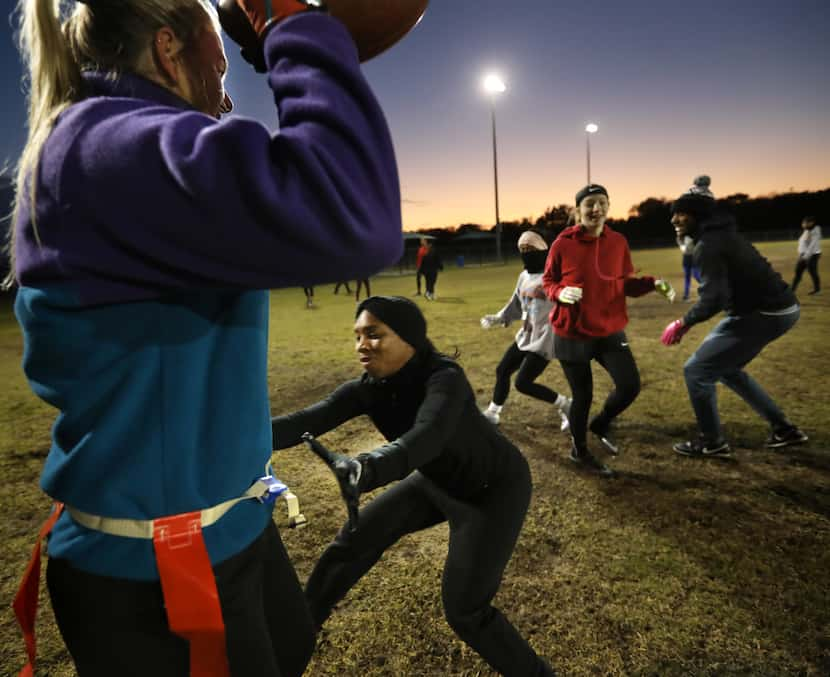 Calli Wood plays quarterback during a scrimmage of the National Gay Flag Football League...