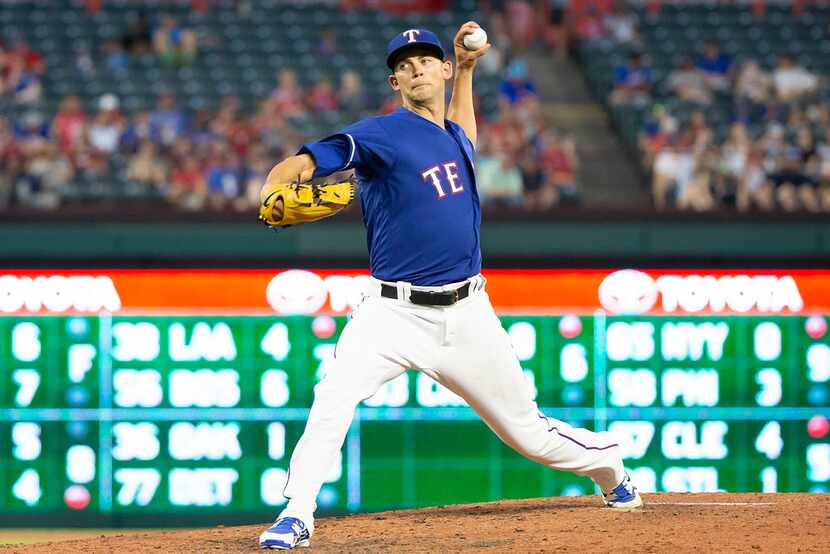 Texas Rangers starting pitcher Mike Minor pitches during the seventh inning against the San...